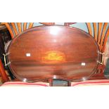 A 24" Edwardian inlaid mahogany kidney shaped tea tray with central shell motif and flanking brass