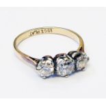 A marked 18ct./PLAT three stone diamond ring