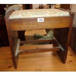 A 1930`s oak piano stool with drop-in seat