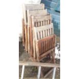 A set of six teak folding chairs
