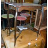 A 26" early 20th Century stained mixed wood two tier occasional table, set on slender cabriole