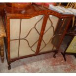 A 3' 11" 1920's walnut and glazed display cabinet with break dome top and two glass shelves enclosed