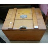 A 20" old waxed pine lift top box with applied brass cock fighting plaque and brass handle to lid,