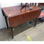 A 35 1/2" Victorian mahogany Pembroke table with drawer to one end and opposing dummy drawer