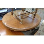 A 4' 5" Victorian mahogany pedestal loo table with oval tilt-top, set on massive turned pillar and