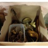 A box of assorted brassware including pair of ibis figurines, Victorian trivet, horse brasses, etc.