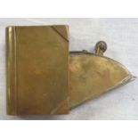 An early 20th Century Trench Art brass book pattern folding cigarette lighter
