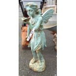 A painted cast iron garden fairy holding a leaf