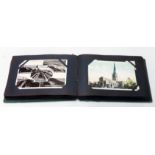 An album containing a quantity of early to mid 20th Century postcards mainly topographic and