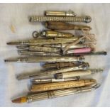 A bag containing assorted vintage propelling pencils including novelty cannon hardstone mounted,