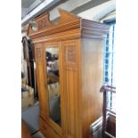 A 4' 2 1/2" Edwardian satin walnut wardrobe with poorly repaired cornice, and hanging space enclosed