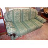 A 6' 3" three seater settee upholstered in green floral tapestry