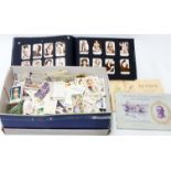 A box containing a collection of cigarette cards including John Player and Wills, sport, vehicles,