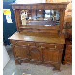 A 5' 1/2" early 20th Century polished oak mirror backed sideboard with domed mirror plate and