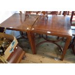 A pair of 21 1/2" reproduction rosewood side tables with bracketed tops, set on square tapered