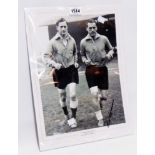 Tom Finney and Nat Lofthouse: an unframed monochrome photograph training for England signed by