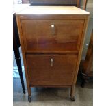 A 19" vintage oak commercial washstand with two fall front compartment to front and towel rail to