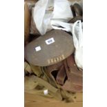 An old leather rugby ball, satchel, canvas bags and horse tack