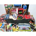 A collection of modern football memorabilia including Arsenal and Manchester United interest,