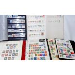 Three albums containing a collection of 20th Century hinge mounted world stamps - sold with red