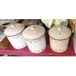 A set of three enamelled storage jars decorated with floral frieze