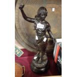 A bronzed spelter female figure