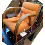 A vintage oak bentwood framed elbow chair with curved back and original studded orange upholstery (