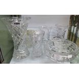 Seven cut glass vases, cut glass bowl, and an associated stand