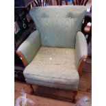A vintage upholstered boudoir armchair with polished wood part show frame and cabriole front legs