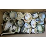 A box containing an Oriental eggshell part tea set and a Royal Albert Moss Rose part tea set