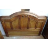 A 5' 6" Victorian mahogany break dome top headboard with panelled and applied decoration