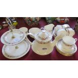 A Paragon Belinda pattern tea service comprising teapot, six trios, milk jug, sugar bowl, and cake