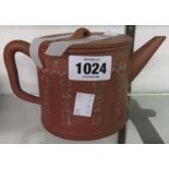 An antique Chinese Yixing zisha terracotta teapot of cylindrical form with infuser and impressed