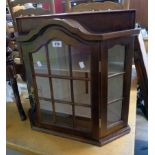 A 23" reproduction mahogany and mixed wood corner display cabinet with break arch top, glazed canted