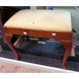 An early 20th Century stained walnut framed dressing stool with upholstered drop-in seat panel,