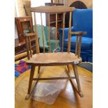 A 20th Century blonde wood stick back rocking chair - sold with a high lath back similar - repairs