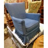 A vintage parlour armchair upholstered in blue material - sold with a matching chair with floral