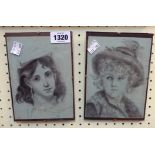 A pair of small clip-framed pencil portraits of children wearing hats