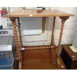 A 24 1/4" late 19th Century mixed wood side table, set on bobbin turned base