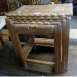 A 1930`s Eastern carved wood quartetto nest of tea tables all with decorative borders, the
