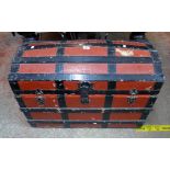 A 35" late 19th Century wood and metal bound dome top travelling trunk with remains of compartment