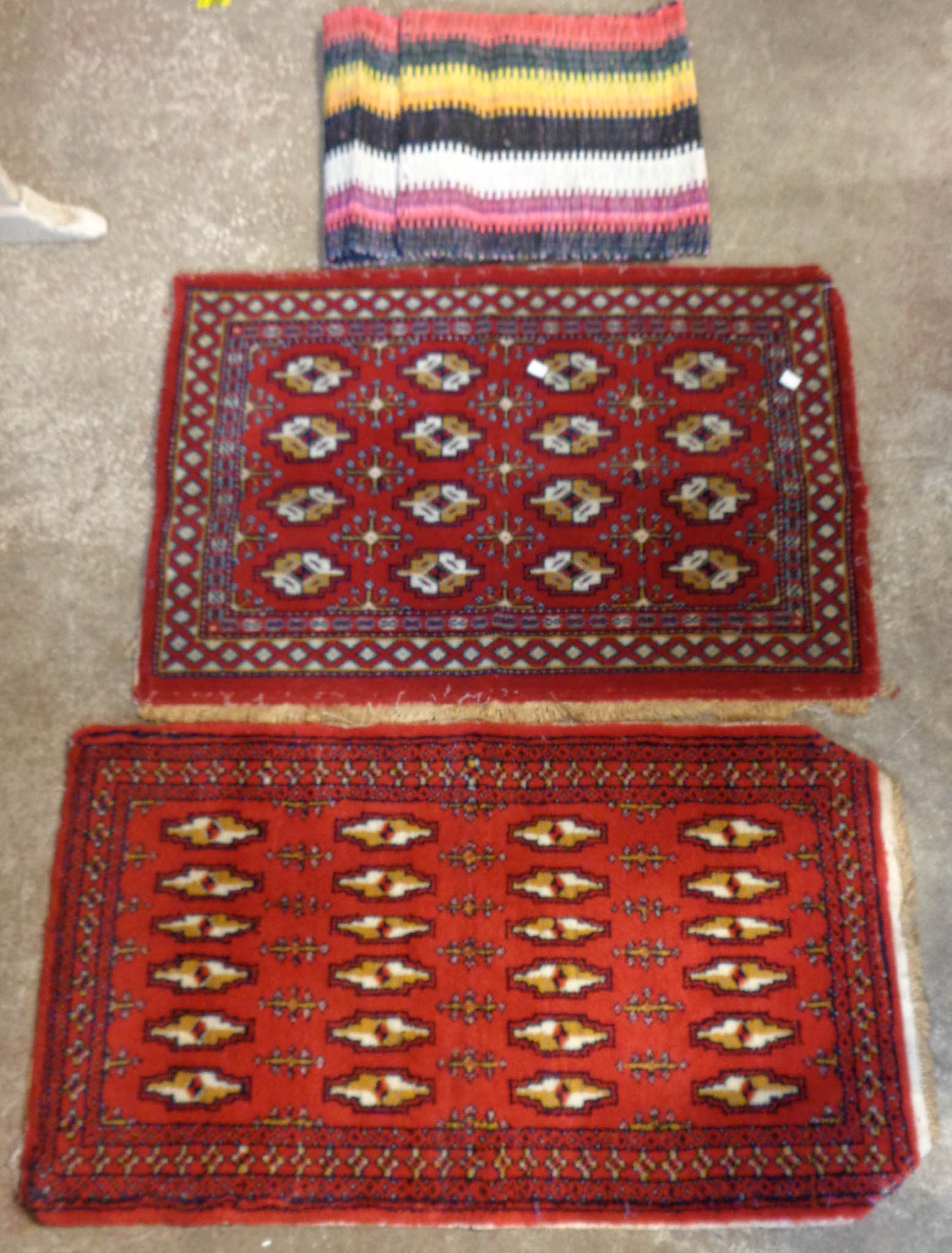 Two small Persian rugs and a saddlebag