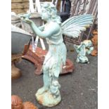 A painted cast iron garden fairy holding a bird