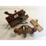 A vintage Stanley No.71 router plane, plough plane, and another