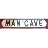 A painted wooden sign Man Cave