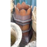 A salt glazed stoneware chimney pot with crowned top