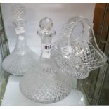 Two moulded glass ships decanters with associated stoppers - sold with a large cut glass basket