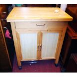 A 27 1/2" modern kitchen preparation unit with butcher's block style top, frieze drawer and pair
