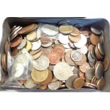 A vintage tin containing a collection of Great British and Commonwealth coinage