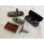 Two pairs of old yellow metal framed spectacles, Laurel razor, and a whistle